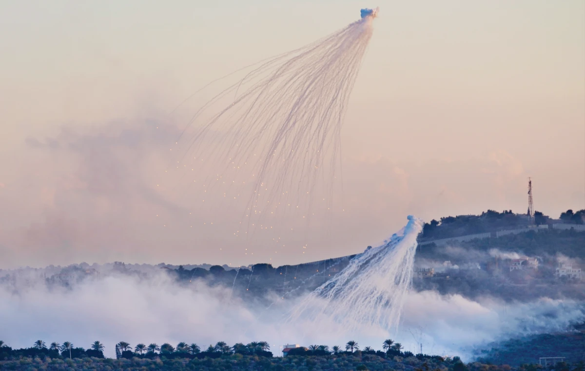 Shells that appears to be white phosphorus from Israeli artillery explode over Dahaira, a Lebanese border village with Israel, south Lebanon, on Oct. 16, 2023. (AP)