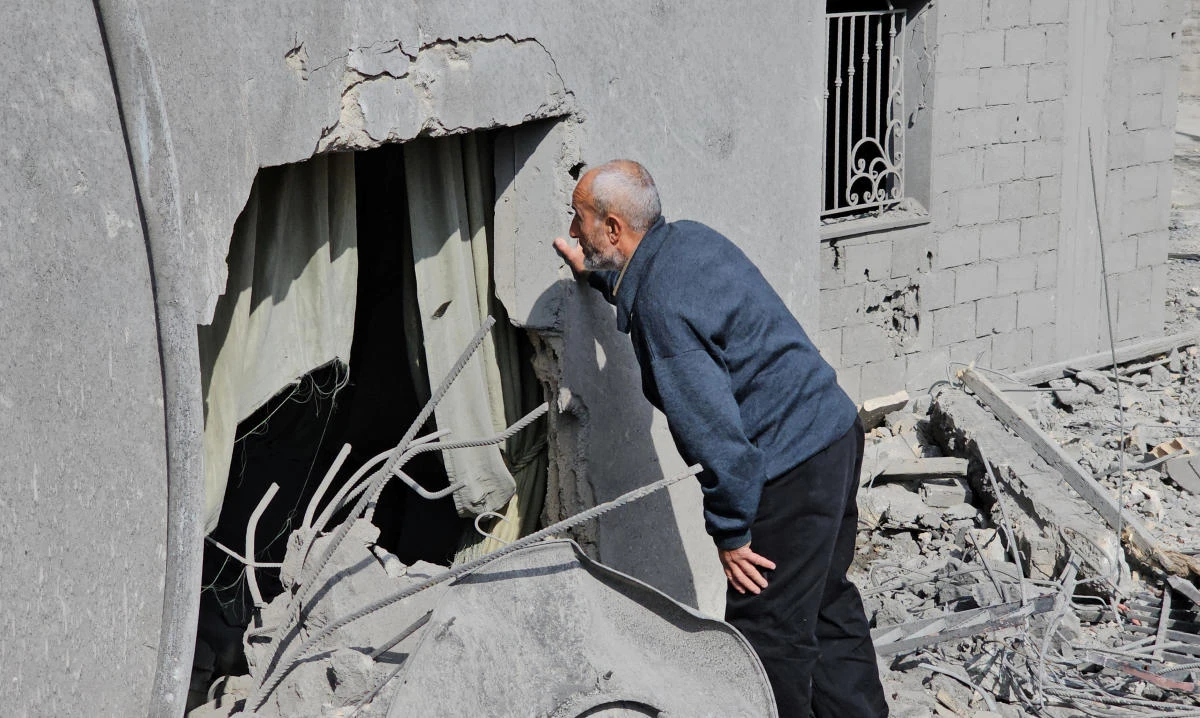 A man inspects his damaged house, in the aftermath of an Israeli strike in Sohmor, in the western part of Lebanon's Bekaa Valley, Lebanon November 10, 2024. (Reuters)