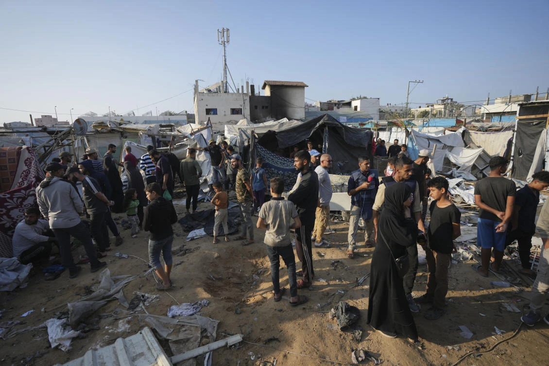 FILE — Palestinians gather at the site of an Israeli strike in the courtyard of the Al-Aqsa Hospital where displaced people live in tents, in Deir Al-Balah, Gaza Strip, on Nov. 9, 2024. (AP)