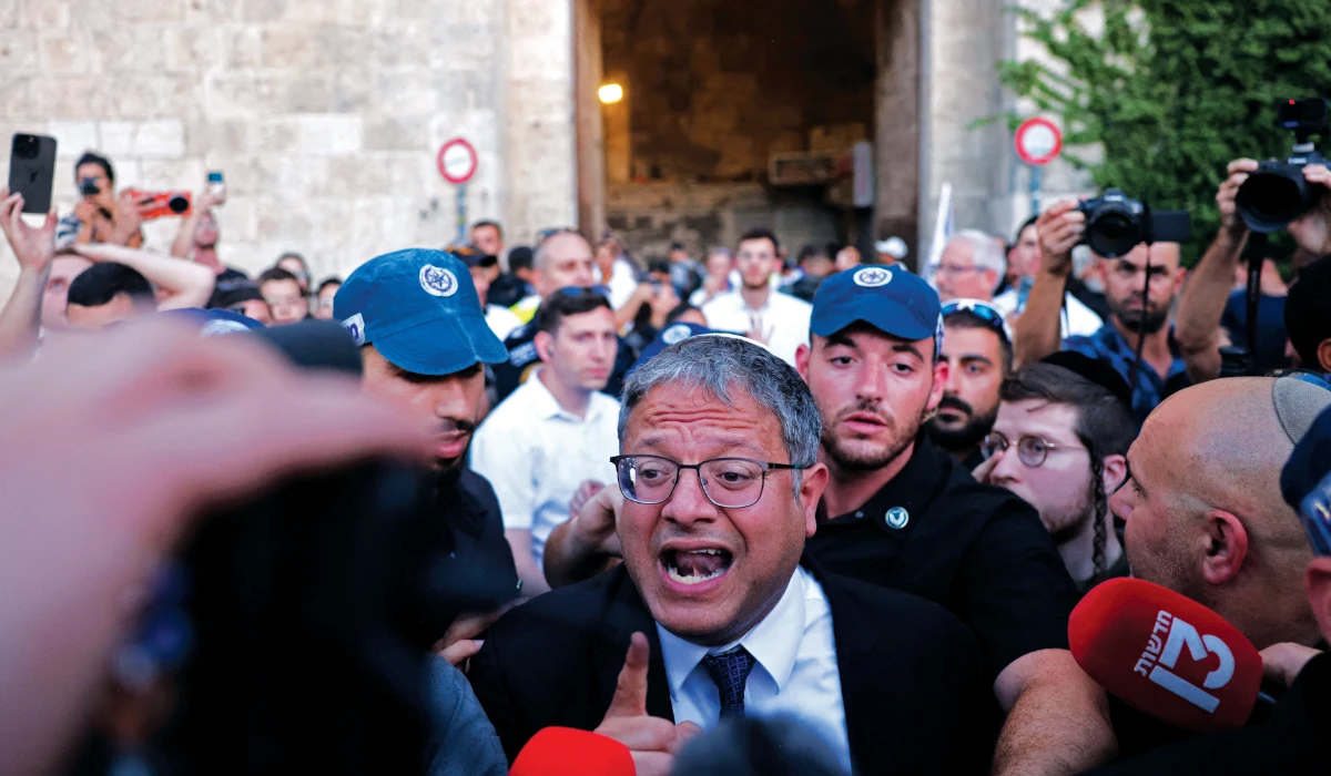 Israel's National Security Minister Itamar Ben-Gvir joins Jewish nationalists, including far-right activists, rallying at Jerusalem's Damascus Gate on June 5, 2024 during the so-called Jerusalem Day flag march, that commemorates the Israeli army's capture in the 1967 Arab-Israeli war of the city's eastern sector, home to the Al-Aqsa mosque compound, Islam's third holiest site, which Jews call the Temple Mount. (AFP)