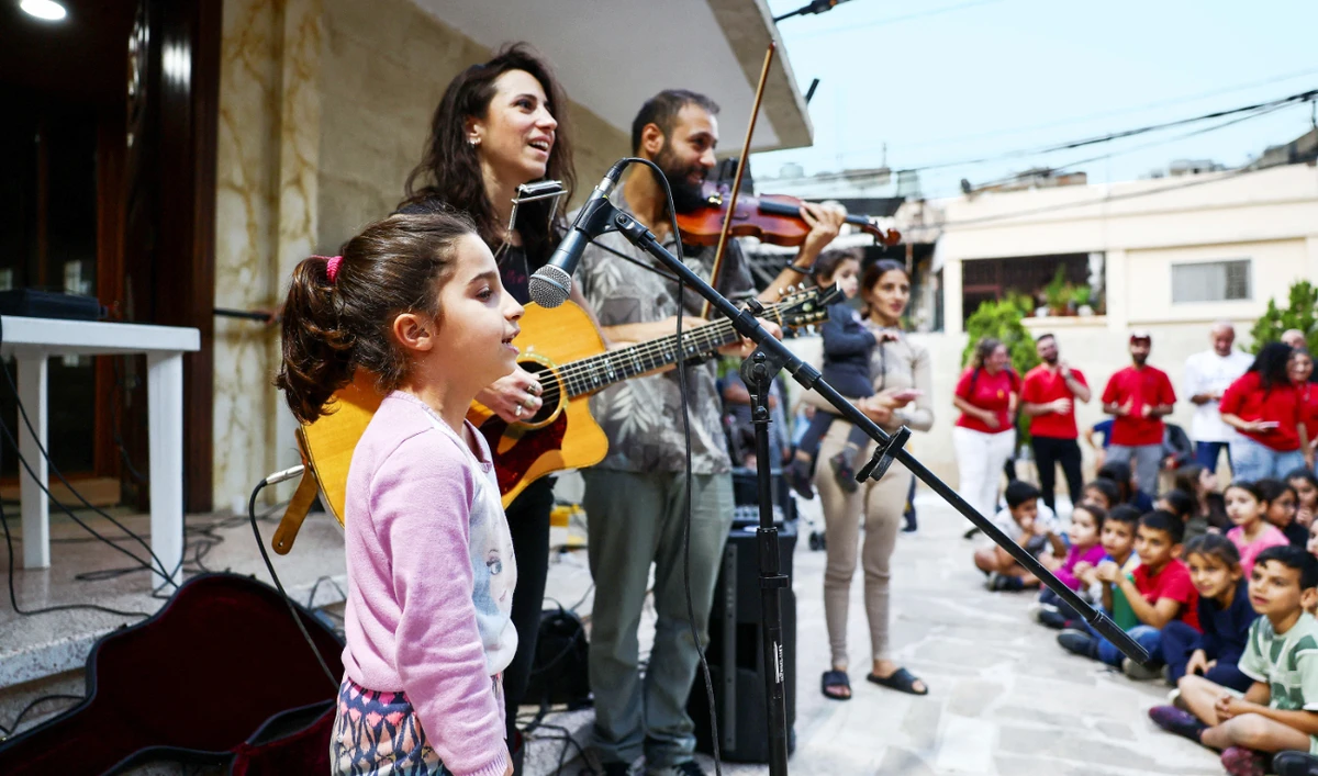 Displaced and refugee children attend a charity event where Lebanese singer Joy Fayad and musician Oliver Maalouf perform in Dbayeh, Lebanon. (Reuters)