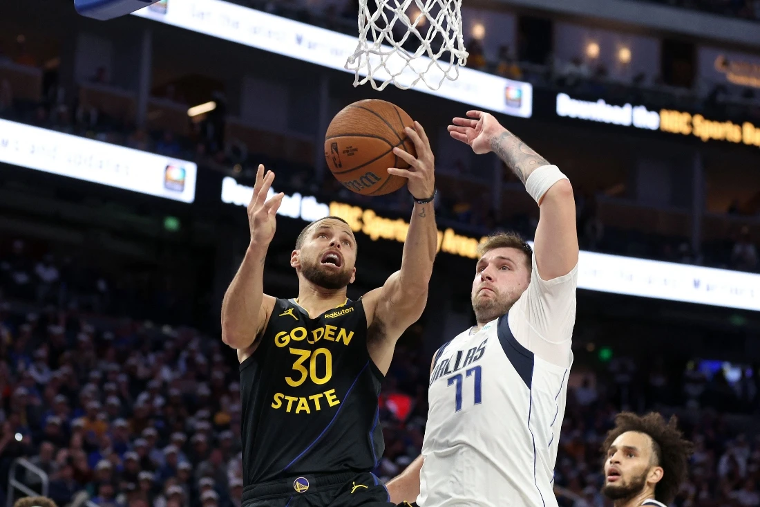 Stephen Curry of the Golden State Warriors goes up for a shot on Luka Doncic of the Dallas Mavericks at Chase Center on Nov. 12, 2024 in San Francisco, California. (Getty Images via AFP)