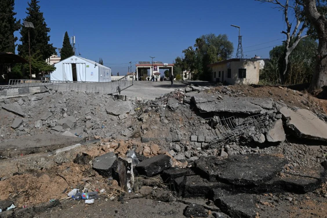 This picture shows a crater caused by an Israeli strike on the road leading to Syria's Jousieh border crossing with Lebanon on October 28, 2024. (AFP)