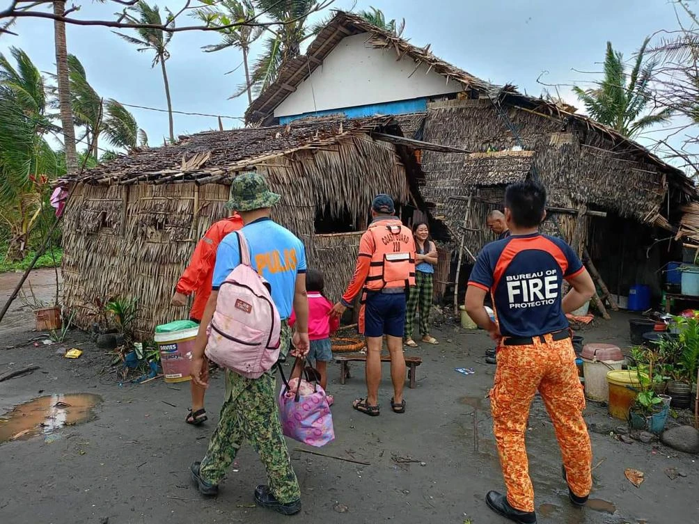 Rescuers fetch residents during a forced evacuation operation in Buguey town, Cagayan province ahead of Super Typhoon Usagi’s landfall on Nov. 14, 2024. (Buguey Municipal Disaster Risk and Reduction Management Office via Cagayan Provincial Public Information/AFP)