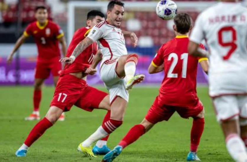 UAE’s midfielder Caio Canedo vies for the ball with Kyrgyzstan’s midfielder Eldiyar Zarypbekov during their 2026 FIFA World Cup Asian qualification match at the Mohammed bin Zayed Stadium in Abu Dhabi on Nov. 14, 2024. (AFP)
