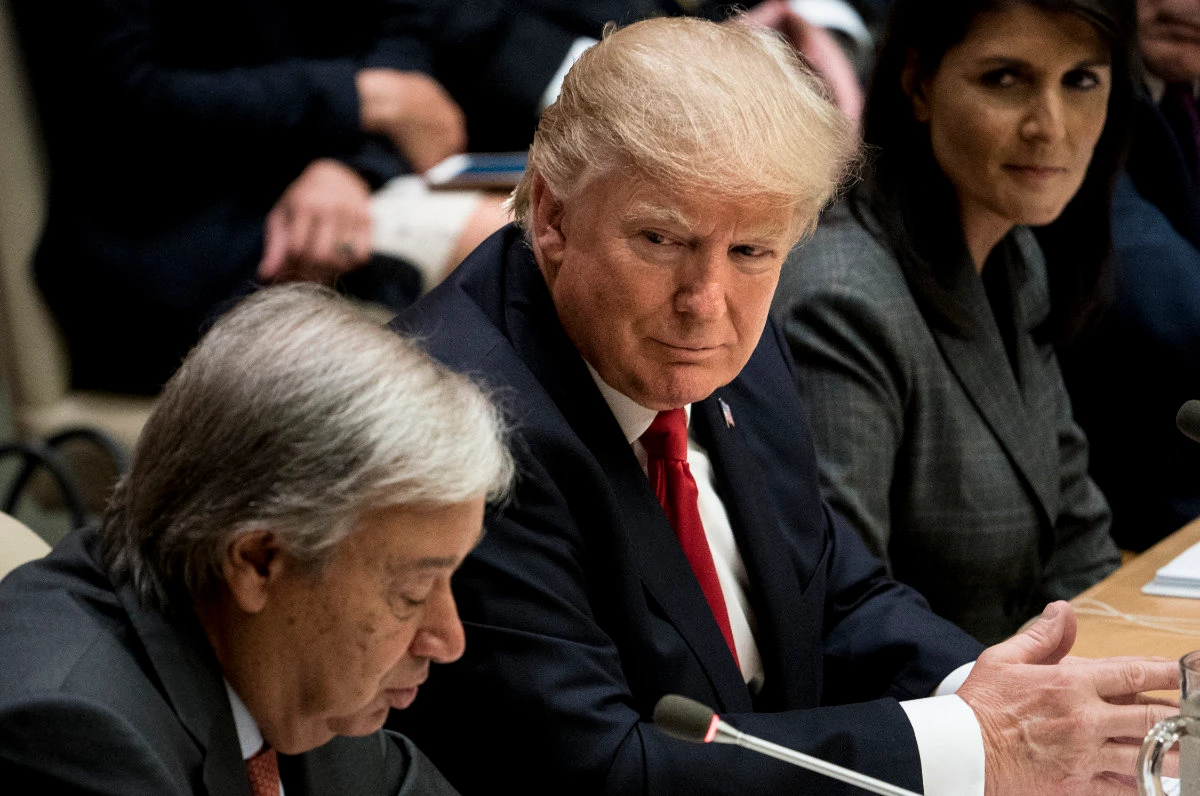 US President Donald Trump listens while UN Secretary-General Antonio Guterres speaks during a meeting on United Nations Reform at the UN headquarters on Sept. 18, 2017 in New York City. (AFP)