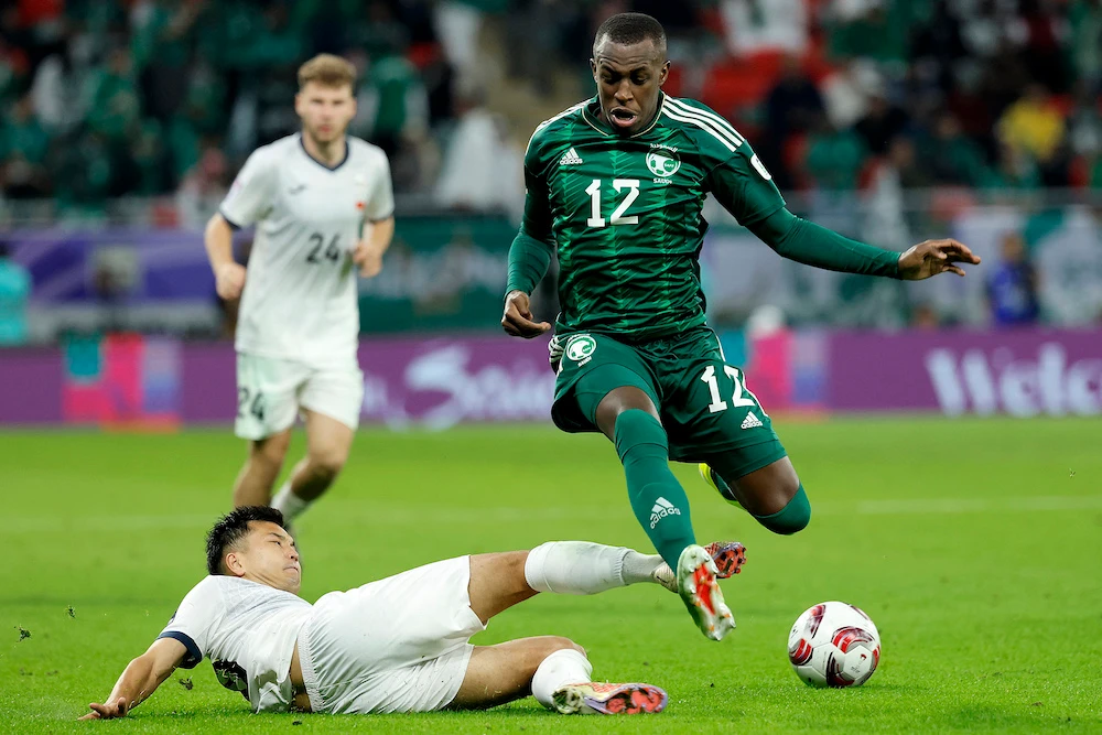 Saud Abdulhamid, right, has become one of the standout players for the Green Falcons. (AFP file photo)