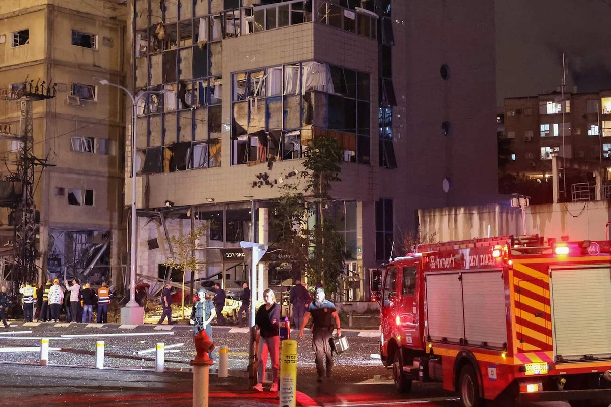 Israeli emergency services work following a rocket attack from southern Lebanon in Ramat Gan, north of Tel Aviv, on November 18, 2024. (AFP)