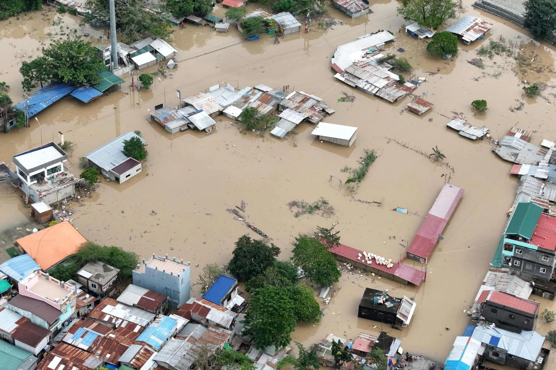 An aerial view shows inundated houses after a river overflow due to floodings caused by heavy rains and induced by Super Typhoon Man-yi in Tuguegarao City, Cagayan province on November 18, 2024. (AFP)