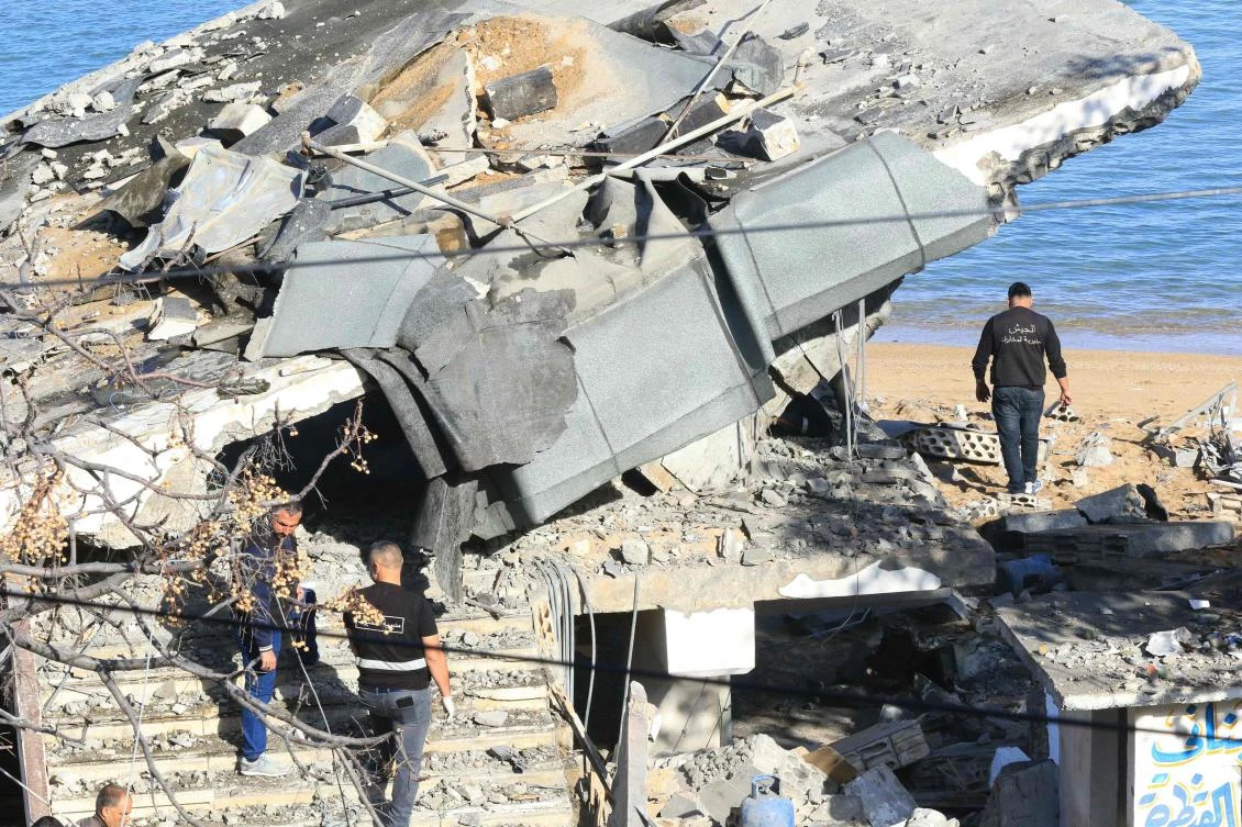 A Lebanese army inspection team check destruction at the site of an overnight Israeli airstrike that targeted one of their positions in the southern Lebanese coastal town of Sarafand on Nov. 20, 2024. (AFP)