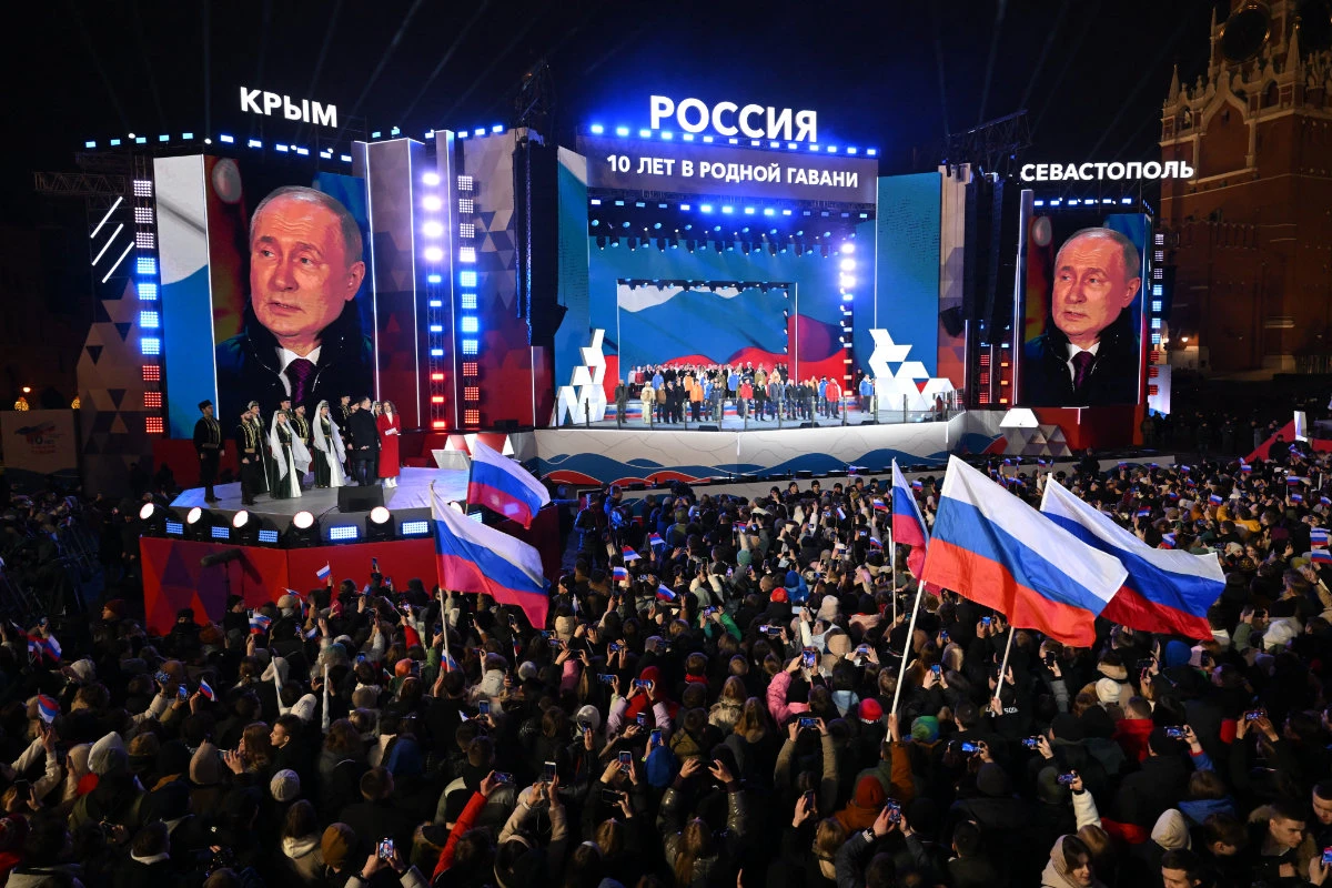 Russian President Vladimir Putin addresses a crowd during a rally and a concert celebrating the 10th anniversary of Russia's annexation of Crimea at Red Square in Moscow on March 18, 2024. (AFP/File)