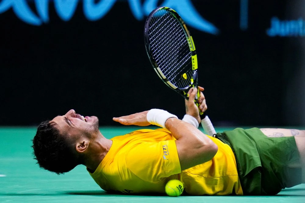 Australia’s Thanasi Kokkinakis celebrates his Davis Cup singles win over the USA’s Ben Shelton at the Martin Carpena Sports Hall, Malaga, Spain, Thursday, Nov. 21, 2024. (AP Photo)