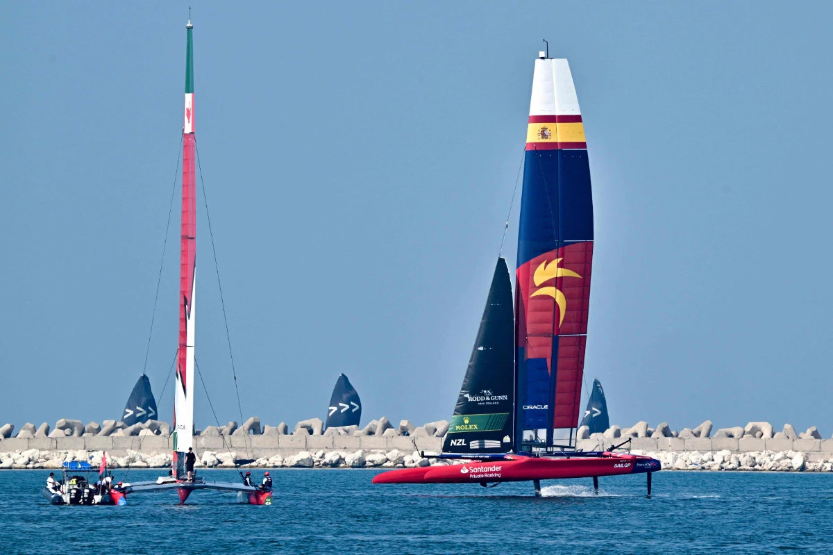 Spain (R) and Canada SailGP teams sail during a training session ahead of the 2024 Emirates Dubai Sail Grand Prix off the coast of Dubai on Nov. 21, 2024. (AFP)