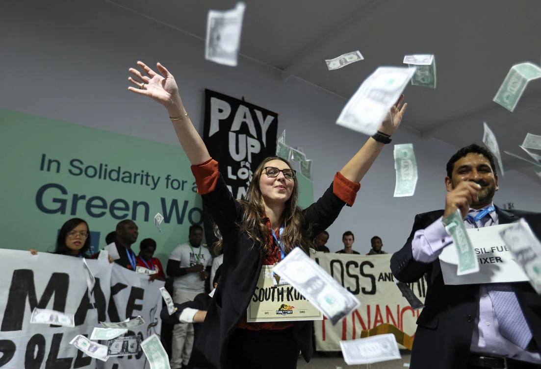 Environmental activists perform during a protest during the COP29 United Nations climate change conference, in Baku, Nov. 21, 2024. (Reuters)