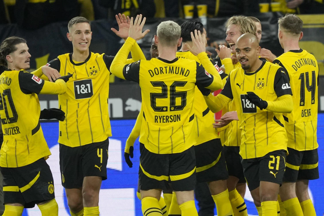Dortmund players celebrate after a goal during their Bundesliga match against SC Freiburg at the Signal-Iduna Park in Dortmund, on Nov. 23, 2024. (AP)
