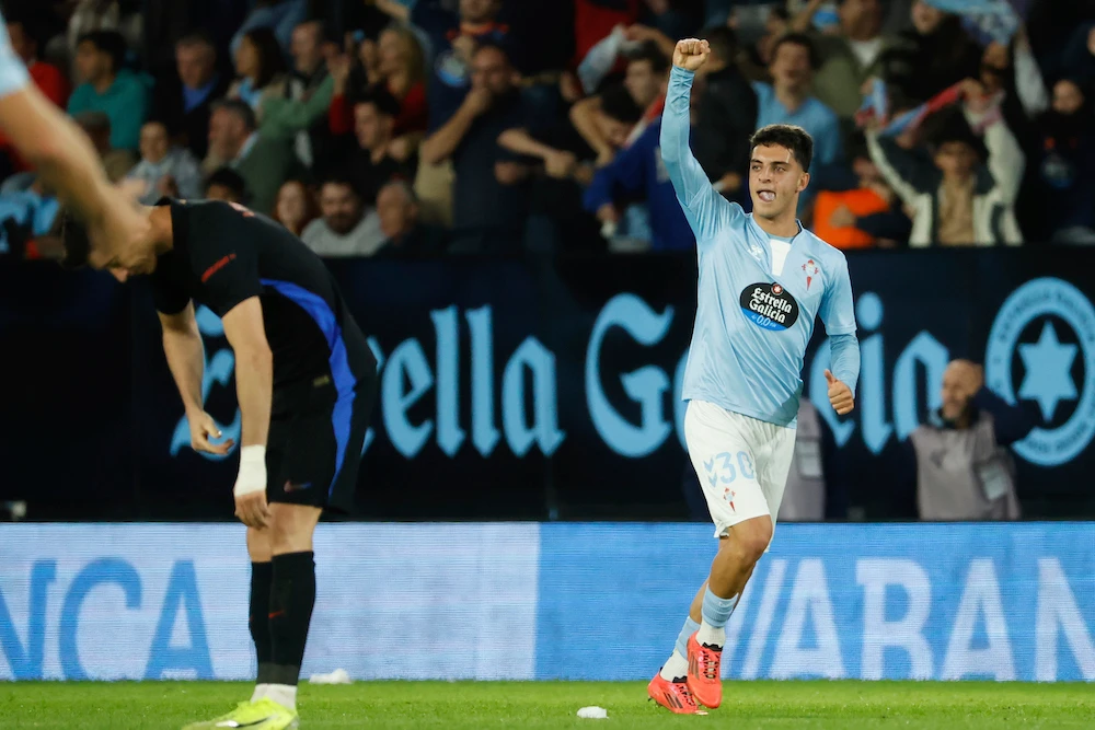 Celta Vigo’s Hugo Alvarez, right, celebrates scoring his side’s second goal and equalizer during the Spanish La Liga match between Celta Vigo and Barcelona at the Balaidos stadium in Vigo, Spain, Saturday. (AP)