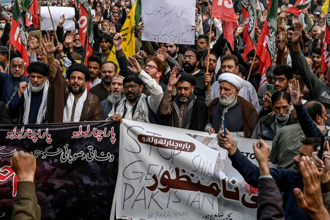 Shiite Muslims hold placards and shout slogans during a protest march against the sectarian attacks in Kurram district in Parachinar, the mountainous Khyber Pakhtunkhwa province, in Lahore on November 22, 2024. (AFP)