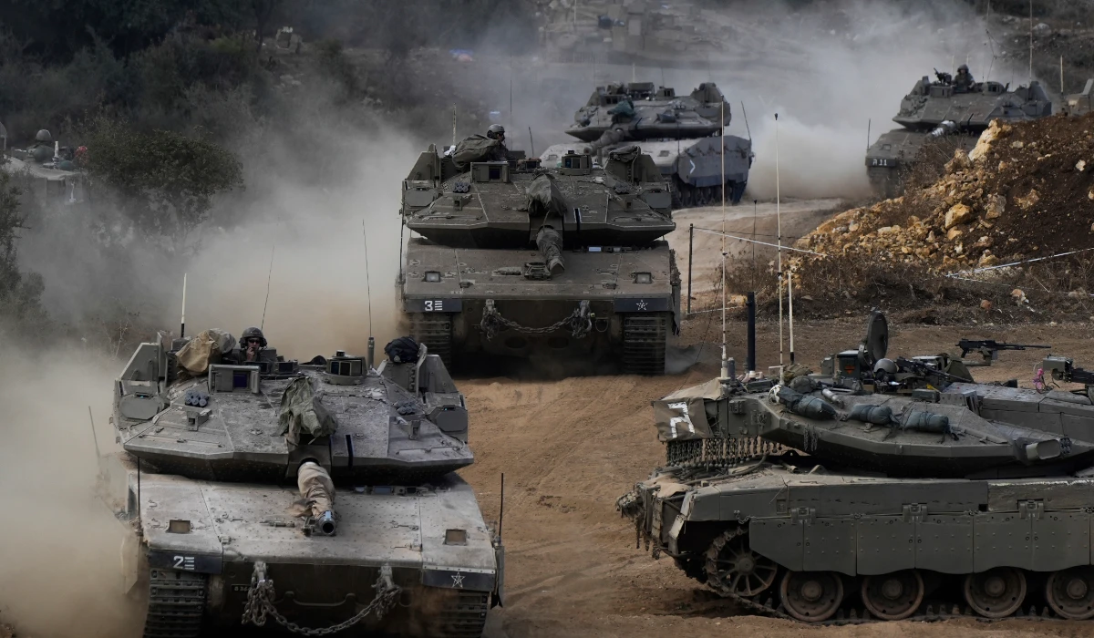 Israeli army tanks maneuver in a staging area in northern Israel near the Israel-Lebanon border, Tuesday, Oct. 1, 2024. (AP)