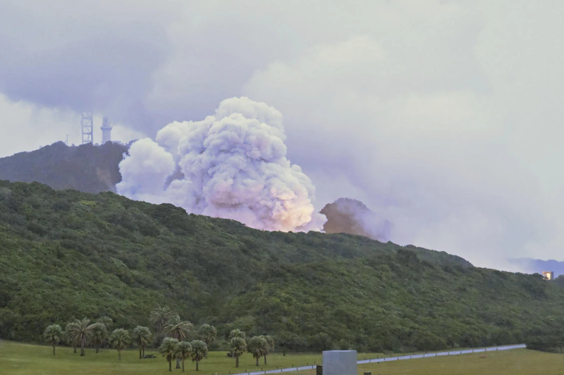 Smoke billows during a combustion test of an engine for new small Japanese rocket Epsilon S at Tanegashima Space Center, Kagoshima prefecture, southern Japan, Tuesday, Nov. 26, 2024. (Kyodo News via AP)