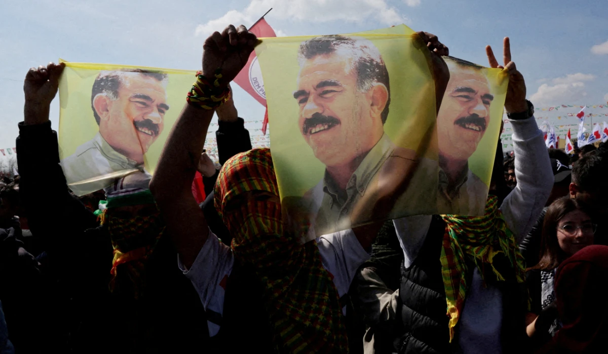 Supporters of pro-Kurdish Peoples' Equality and Democracy Party (DEM Party) display flags with a portrait of jailed Kurdistan Workers Party (PKK) leader Abdullah Ocalan, during a rally to celebrate Nowruz, which marks the arrival of spring, in Istanbul, Turkey, March 17, 2024. (REUTERS)