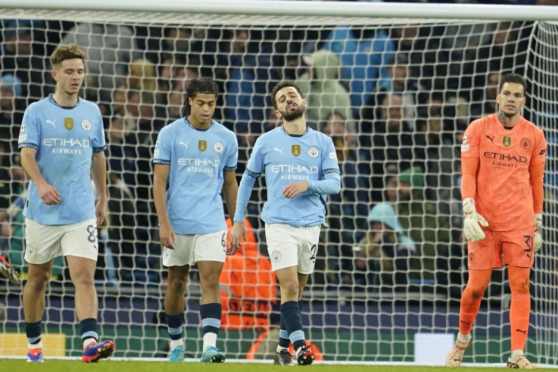 City players react after Feyenoord’s third goal. (AP)