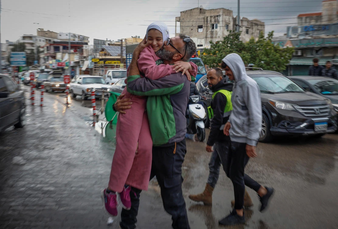 Mohammed Sleem hugs his daughter Menisa Sleem, as he meets her after two months, according to Mohammed, after a ceasefire between Israel and Hezbollah took effect in Tyre, Lebanon, on Nov. 27, 2024. (Reuters)