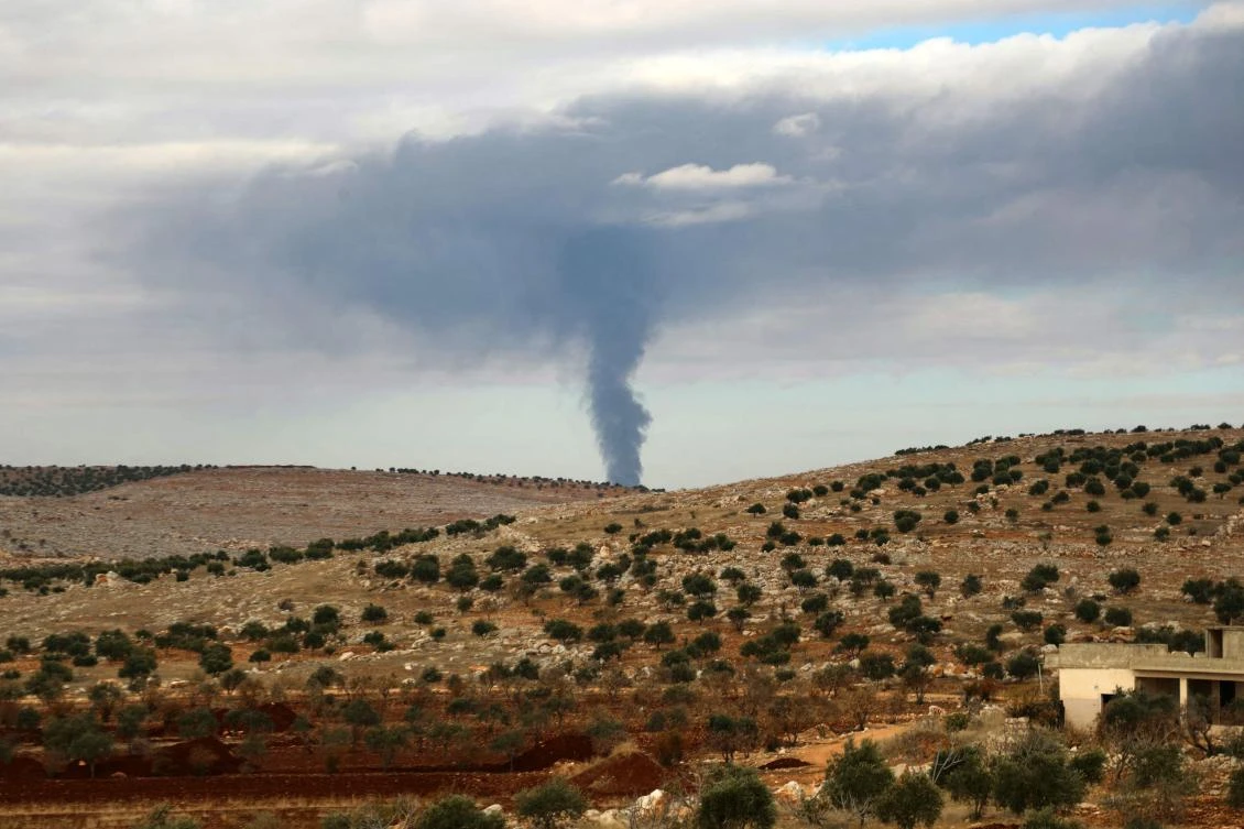Smoke rises during clashes between fighters from Hayat Tahrir al-Sham (HTS) and the Syrian army, in the eastern outskirts of the town of Atarib in Syria's northern province of Aleppo on November 27, 2024. (File/AFP)