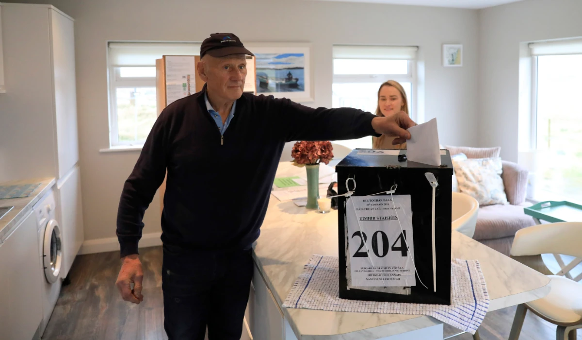 A man casts his vote at a polling station on the Island of Gola as voters go to polls the for the 2024 general election in Ireland on Friday. (AP)