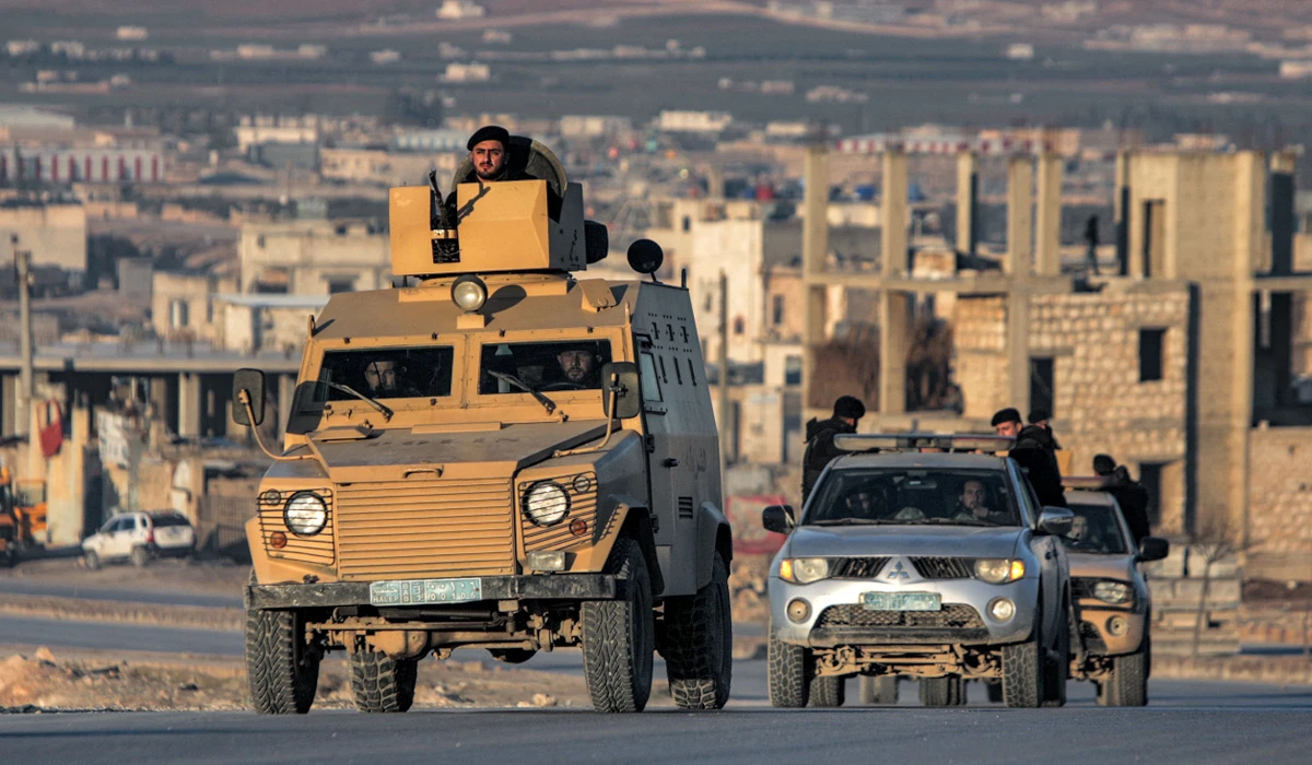 Turkey-backed Syrian fighters deploy in vehicles in al-Bab in the northern part of Syria's Aleppo province. (AFP)