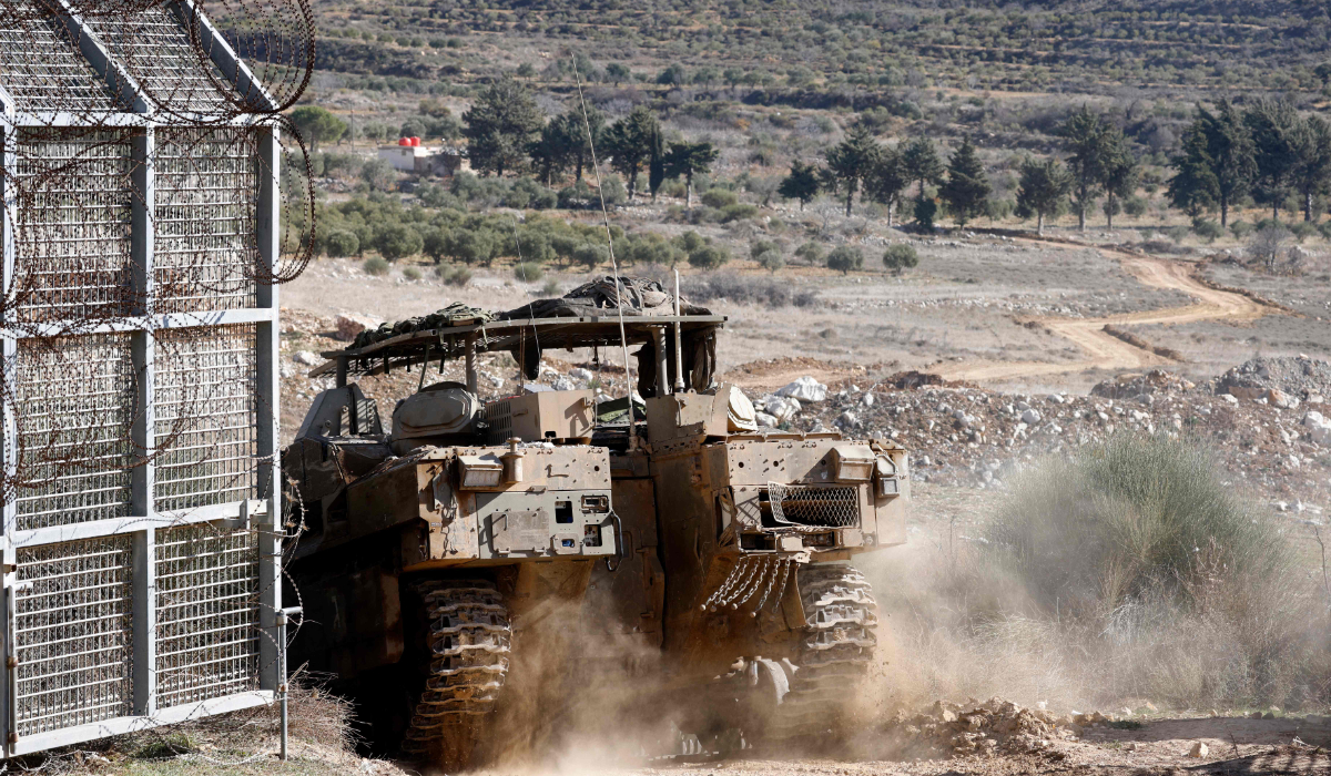 An Israeli army vehicle crosses through the fence into the UN-patrolled buffer zone. (AFP)