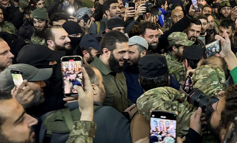 Abu Mohammed Al-Golani greets supporters in Ummayad Mosque, Damascus, Syria, Dec. 8, 2024. (Reuters)