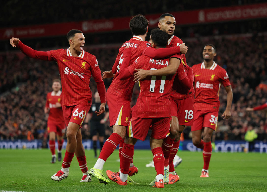 Liverpool’s Cody Gakpo celebrates scoring their first goal with Mohamed Salah and Dominik Szoboszlai. (Reuters)