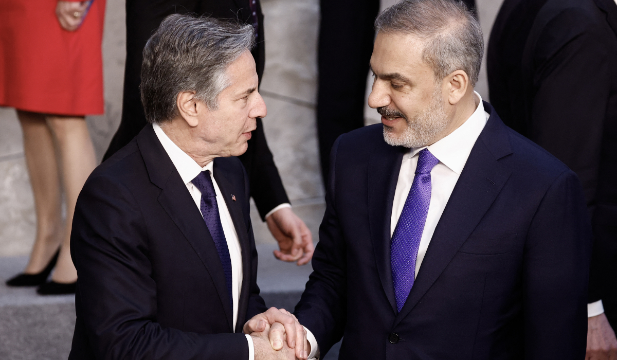 US Secretary of State Antony Blinken (L) shakes hands with Turkish Foreign Minister Hakan Fidan (R) after an official photo during the North Atlantic Council (NAC) Ministers of Foreign Affairs meeting at the NATO headquarters in Brussels on April 3, 2024. (AFP)