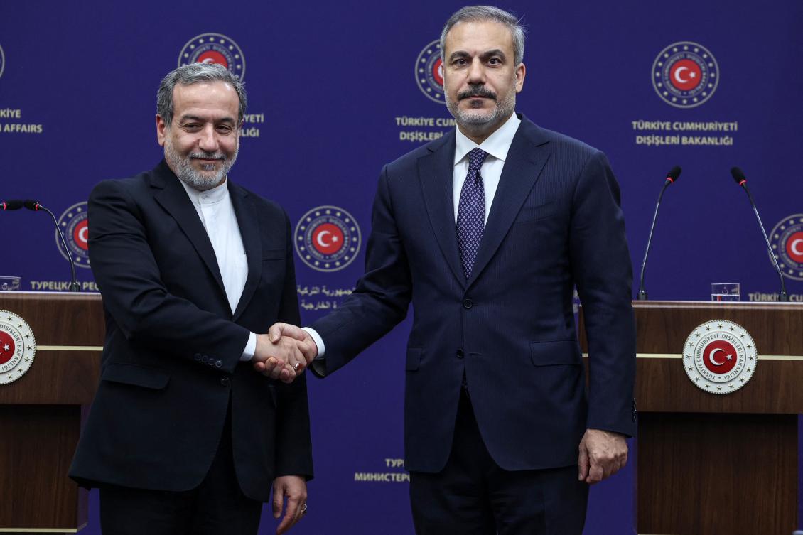 Turkish Foreign Minister Hakan Fidan (R) shakes hands with Iranian Foreign Minister Abbas Araghchi (L) at the end of a joint press conference after their meeting in Ankara on December 2, 2024. (AFP)