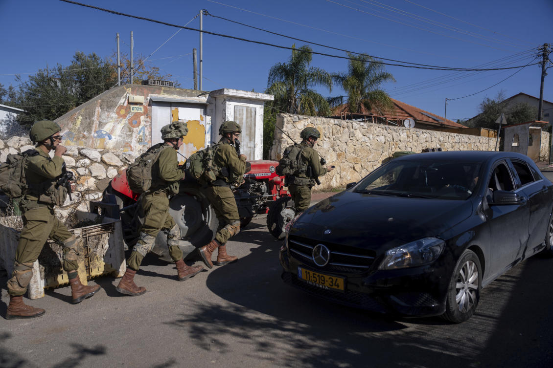 Above, Israeli soldiers patrol the perimeter of the agricultural settlement of Avivim next to the Lebanese border on Dec. 2, 2024. (AP)
