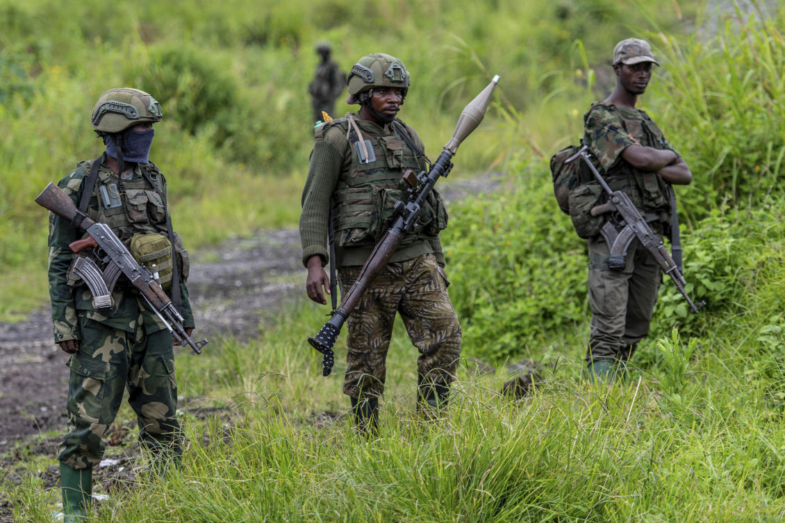 In July, Congo signed a ceasefire with M23, which came into effect in August, but fighting has resumed since. Above, M23 rebels stand with theirs weapons in Kibumba on Dec. 23, 2022. (AP)