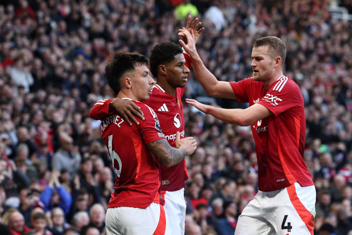 Manchester United’s English striker Marcus Rashford celebrates with teammates Argentinian defender Lisandro Martinez and Dutch defender Matthijs de Ligt after scoring the opening goal of their English Premier League match against Everton at Old Trafford on Dec. 1, 2024. (AFP)