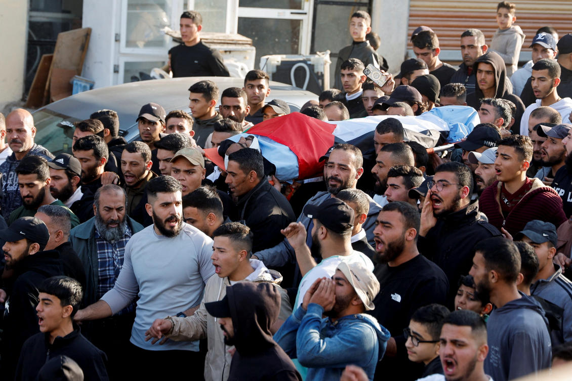 People carry a body during the funeral of Palestinians killed in an Israeli strike, in Aqaba near Tubas, in the West Bank, Dec. 3, 2024. (Reuters)