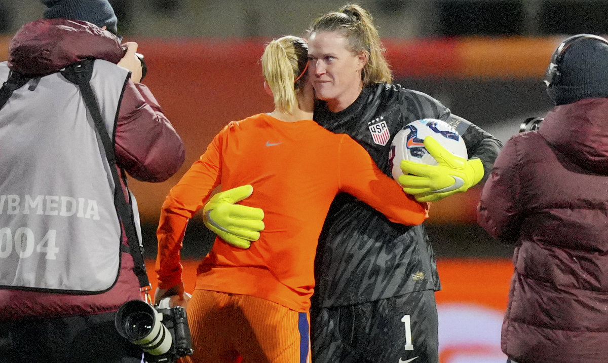 Netherlands' Jackie Groenen and US goalkeeper Alyssa Naeher share a hug at the end of the international friendly women's soccer match between the Netherlands and the US at the ADO Den Haag Stadium in The Hague, Netherlands, Tuesday. (AP)