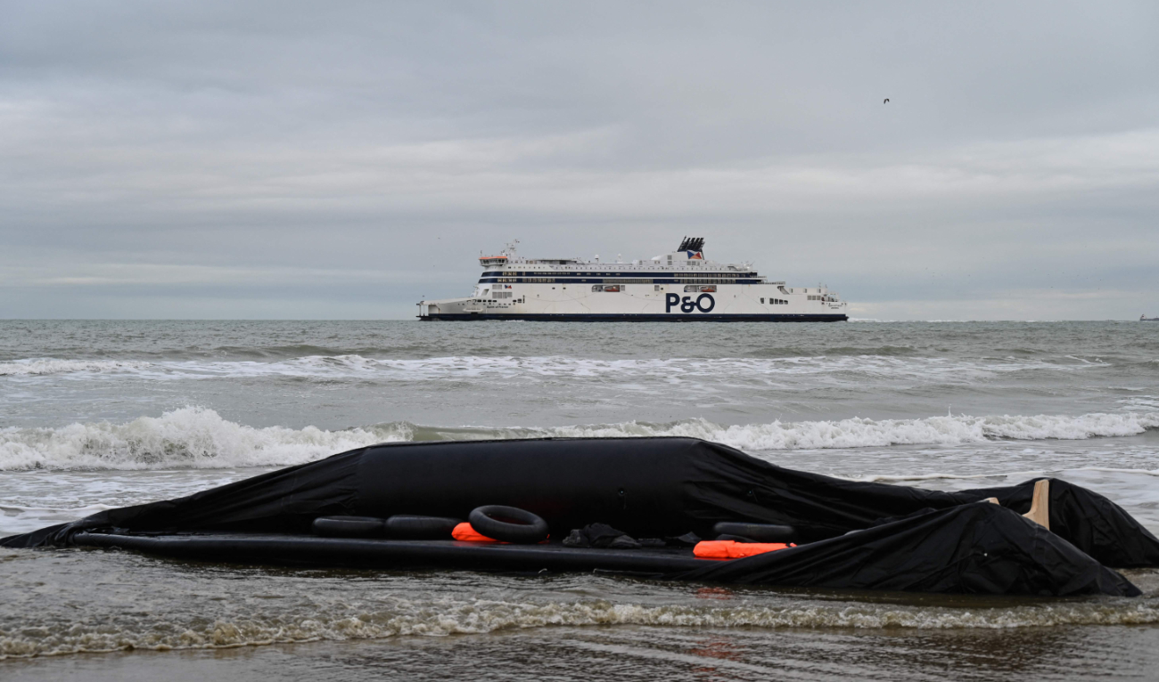 Life jackets, buoys and an deflated inflatable boat are seen, as a P&O Ferry sails in the background, after a failed attempt by migrants to illegally cross the English Channel to reach Britain, on the beach of Sangatte, near Calais, northern France, on December 4, 2024. (AFP)