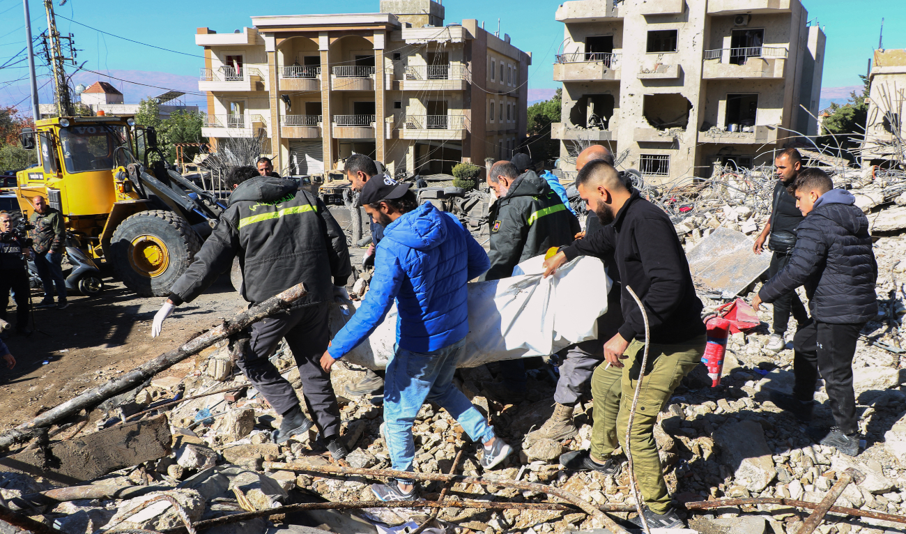 Rescuers evacuate the body of a civil defence officer from the site of an overnight Israeli airstrike that targeted a civil defence facility in Lebanon's eastern village of Douris in the Bekaa valley, on November 15, 2024. (AFP/File)