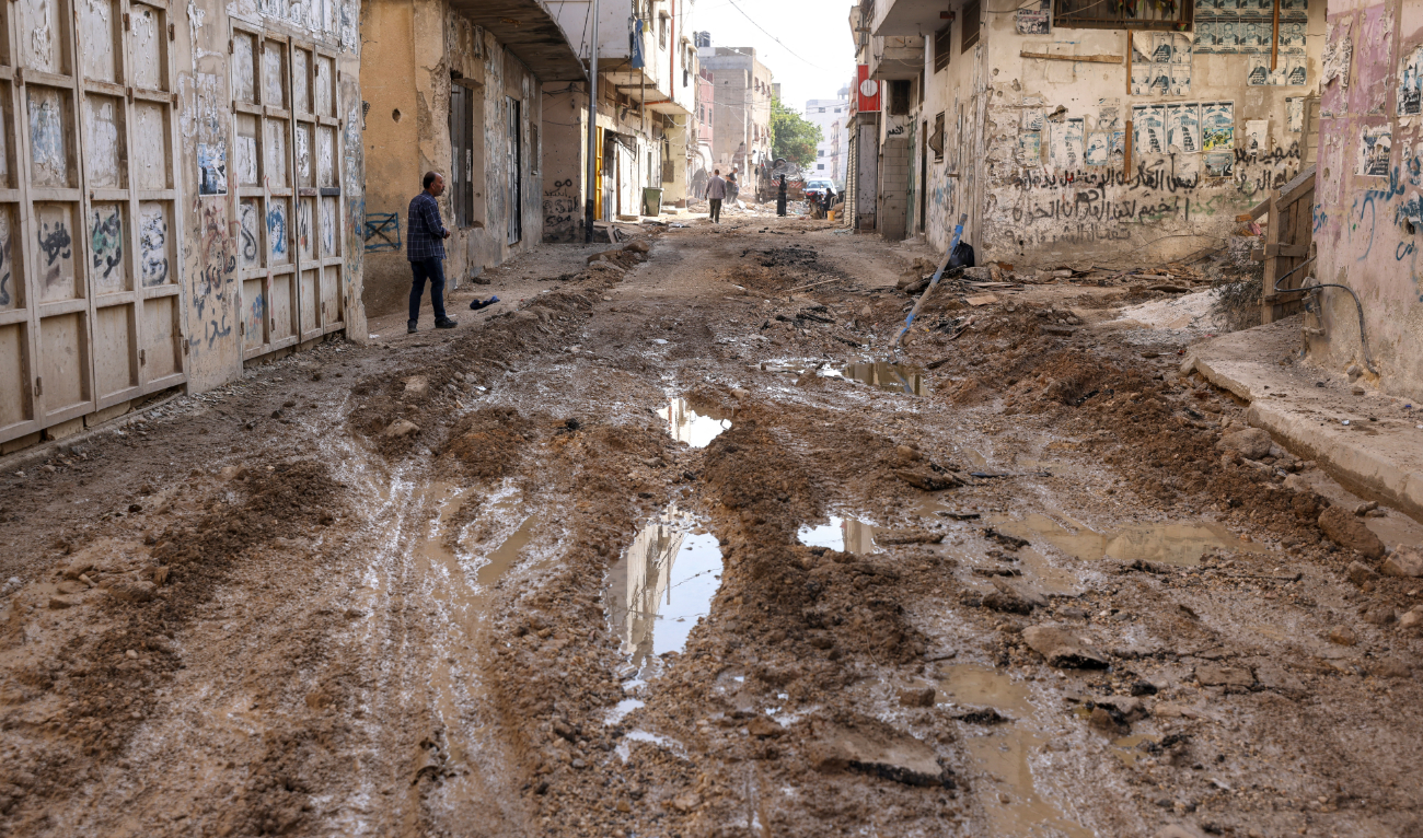 A Palestinian man walks in a destroyed road in the Jenin camp, in the occupied West Bank, on November 7, 2024. (AFP/File)