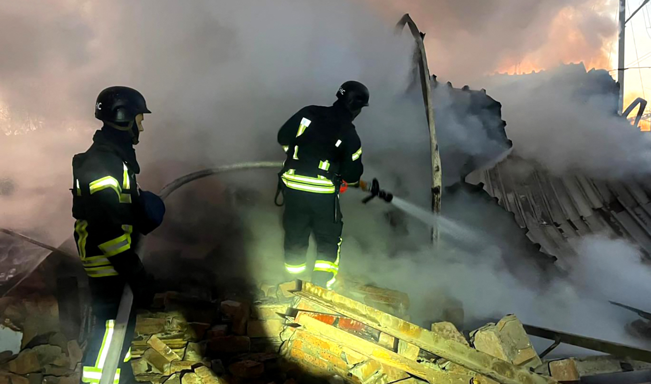 In this handout photograph taken and released by the Ukrainian Emergency Service on November 28, 2024, Ukrainian rescuers work to extinguish a fire at an energy infrastructure facility following a missile attack in Lutsk, Volyn region. (AFP/File)