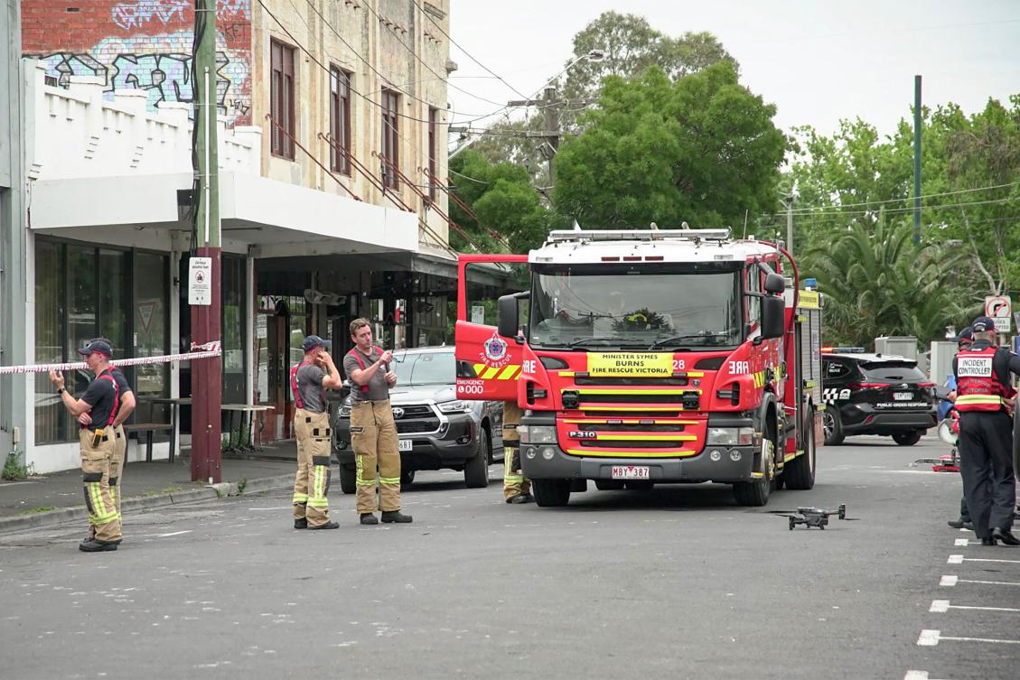 Firefighters gather at the scene of a fire at the Adass Israel Synagogue in Melbourne on Dec. 6, 2024. The synagogue had increased security over the past 12 months amid safety concerns. (AFP)