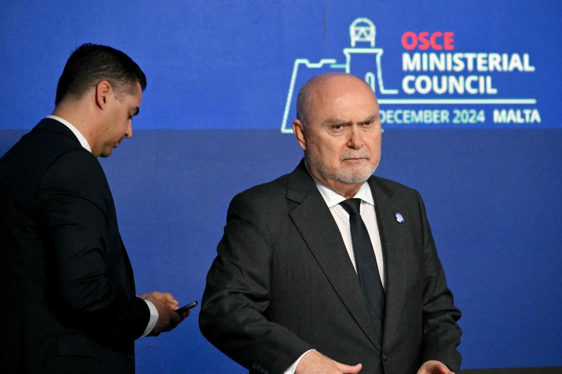 OSCE newly appointed secretary general Feridun Sinirlioglu (R) and Chairperson-in-Office Malta’s foreign minister Ian Borg (L) arrive for the closing press conference of the 31st Organization for Security and Cooperation in Europe ministerial summit in Malta, on Dec. 6, 2024. (AFP)