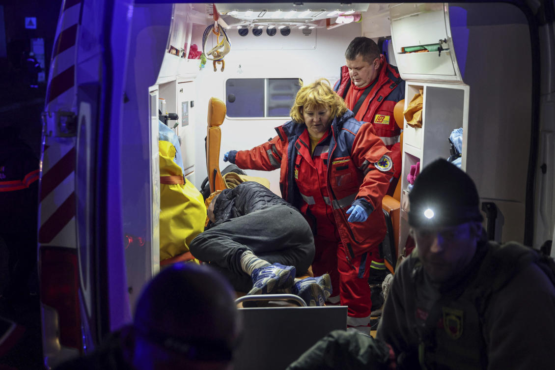 Ambulance paramedics provide first aid to a man injured by a Russian strike in Zaporizhzhia, Ukraine, December 6, 2024. (AP)