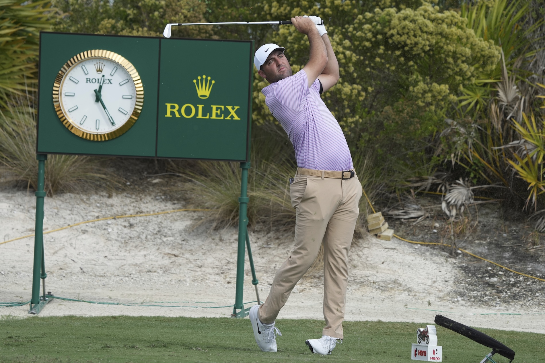 Scottie Scheffler, of the US, watches his shot at the second hole during the second round of the Hero World Challenge at the Albany Golf Club, in New Providence, Bahamas, Friday. (AP)