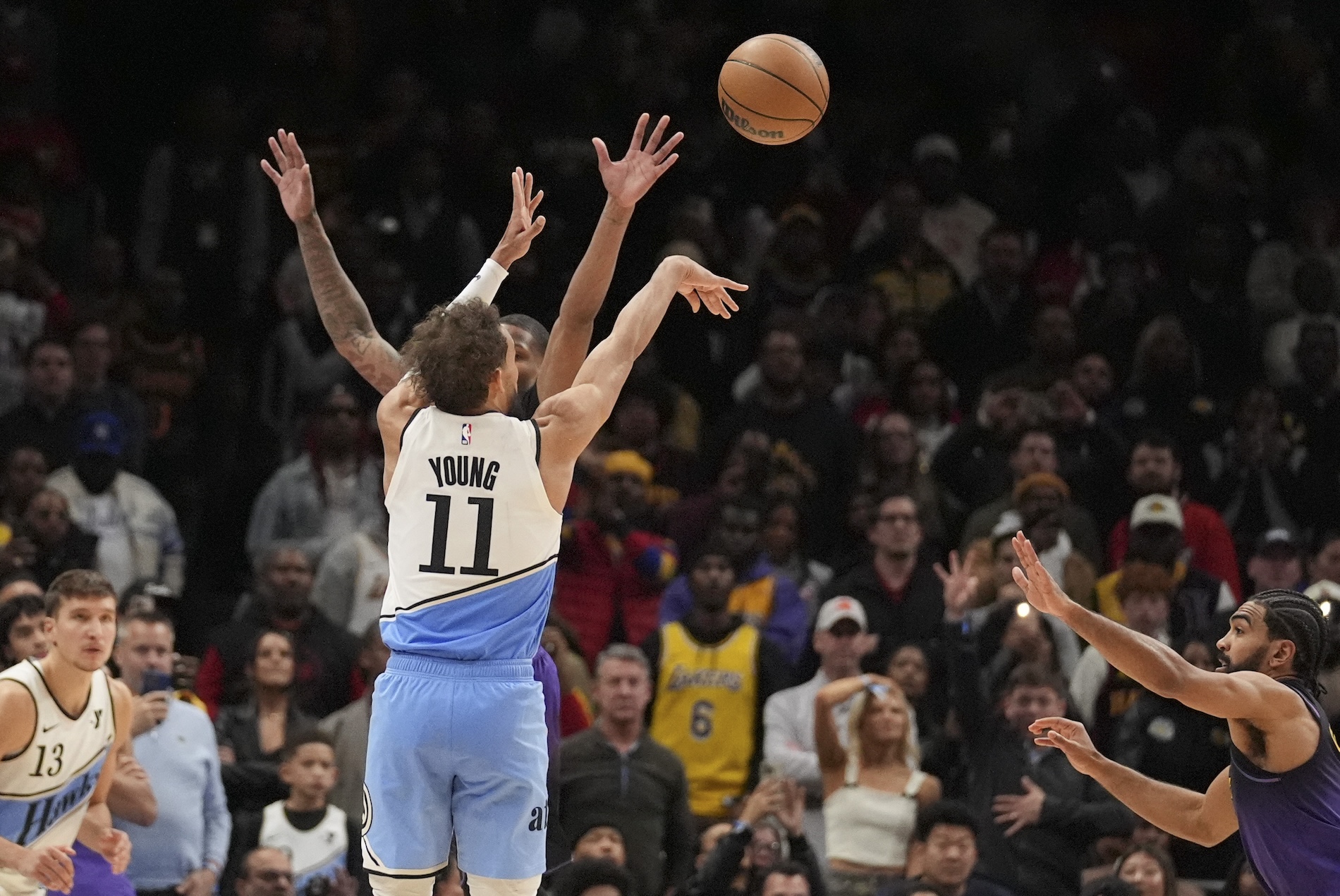 Atlanta Hawks guard Trae Young (11) scores, winning an NBA basketball game against the Los Angeles Lakers Friday in Atlanta. (AP)