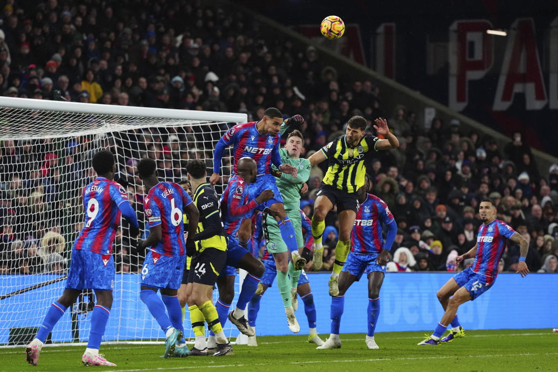 Manchester City’s John Stones, top right, Crystal Palace’s Maxence Lacroix and goalkeeper Dean Henderson battle for the ball during their English Premier League match at Selhurst Park in London, Dec. 7, 2024. (AP)