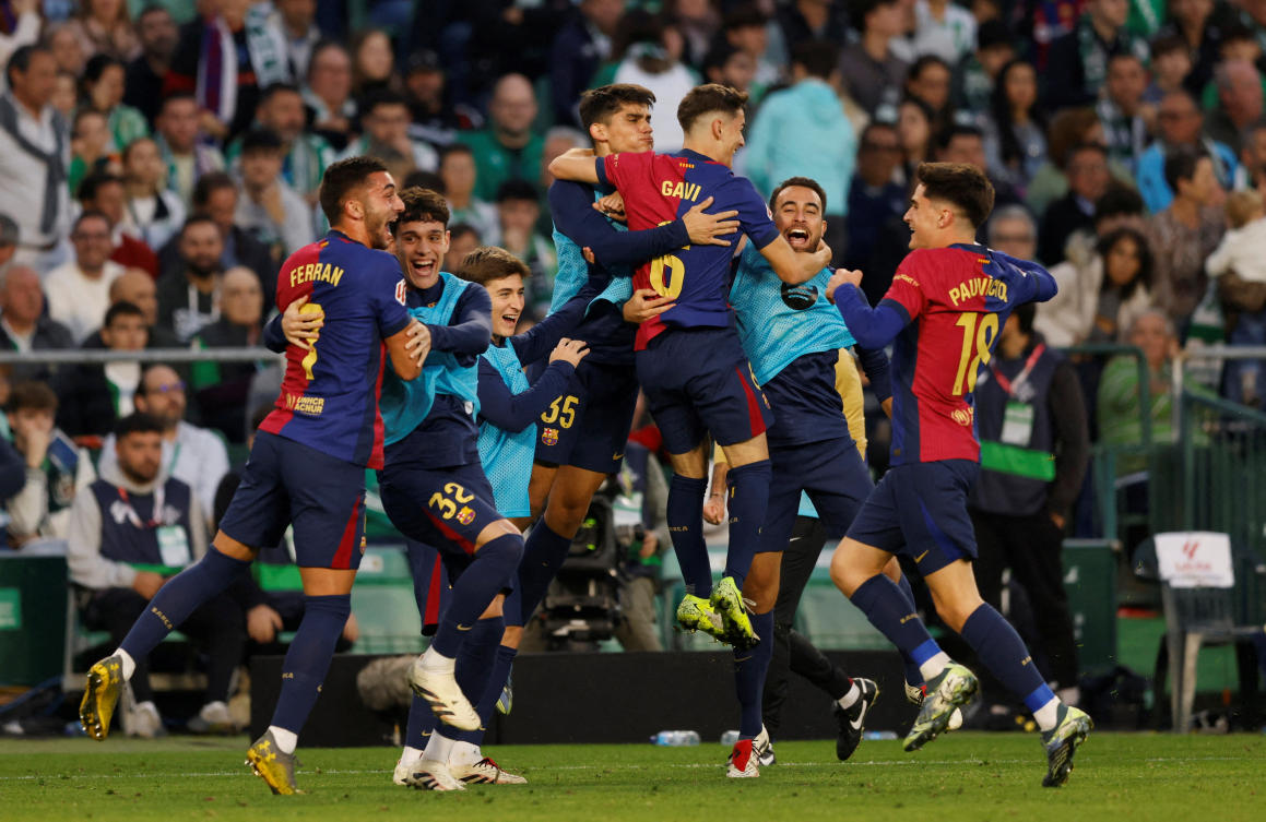 FC Barcelona’s Ferran Torres celebrates scoring their second goal with teammates during their LaLiga against Real Betis at Estadio Benito Villamarin, Seville, Dec. 7, 2024. (Reuters)